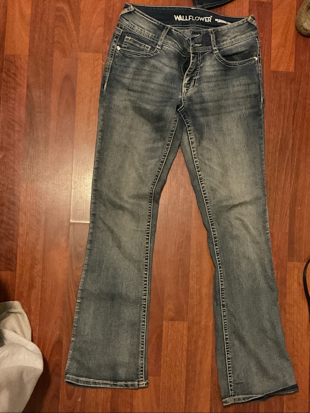 Wallflower Women's Flare Jeans in Faded Blue Wash with rhinestone pockets